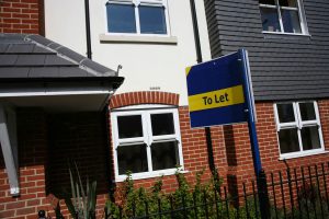 To Let sign outside new build houses and flats