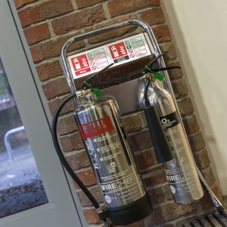 A silver water extinguisher and CO2 extinguisher