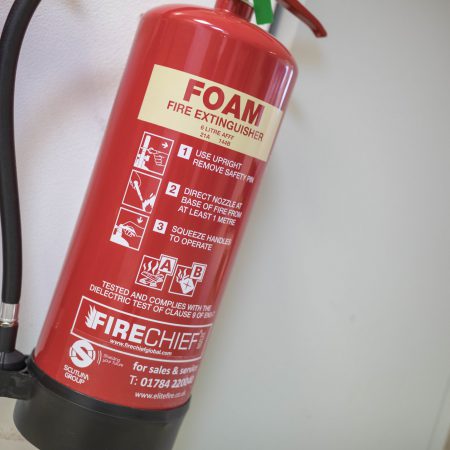 A foam fire extinguisher on a wall