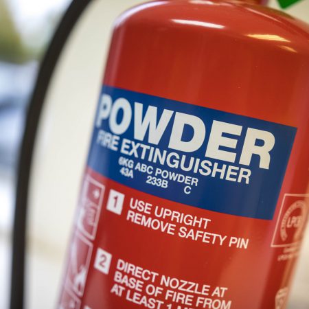 A close up of a powder fire extinguisher