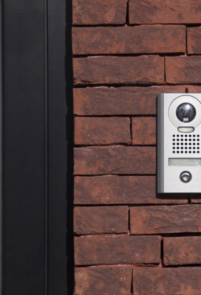 video door entry camera on side of building